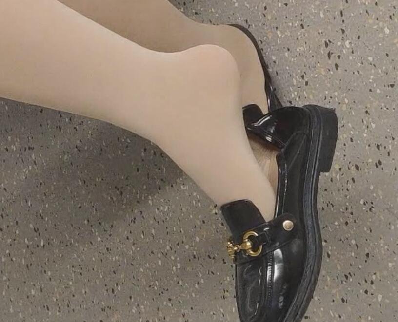 The lady in white heels dangling shoeplay when waiting for a call 16