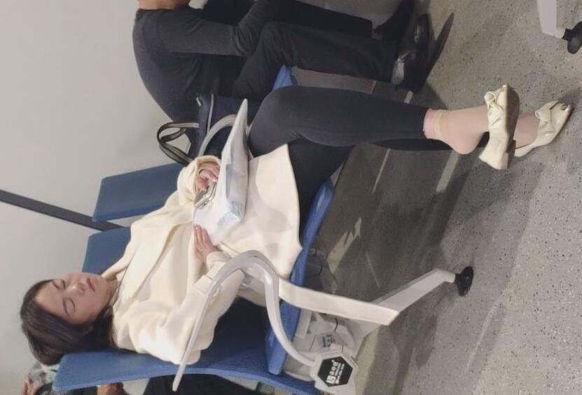 The beautiful woman fell asleep with dangling 