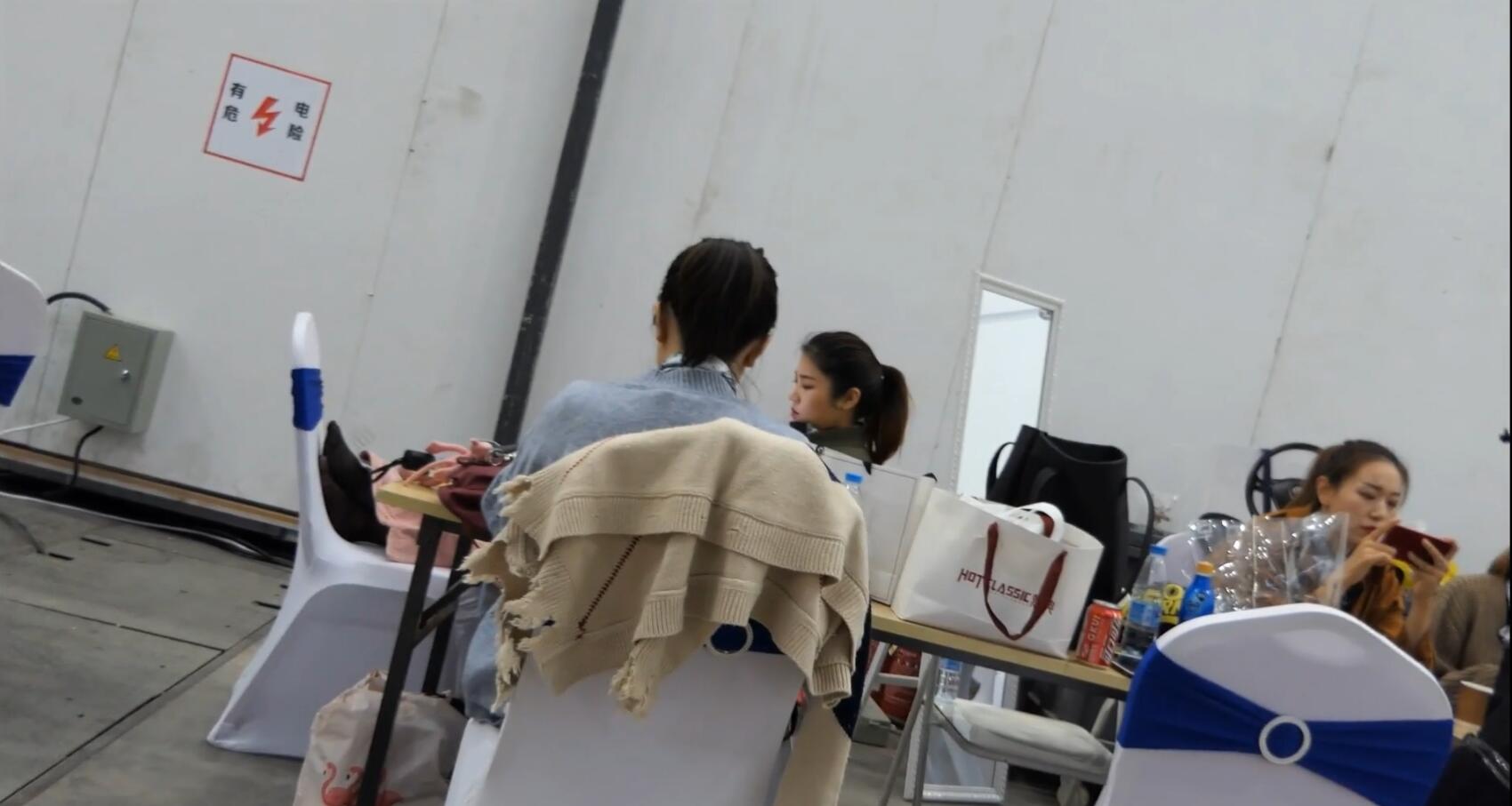 hostress put her feet on chair