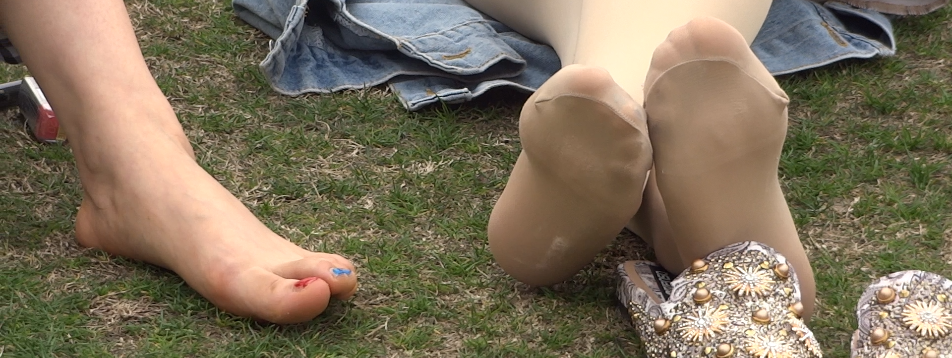 Black and white nylon feet on the grass 21