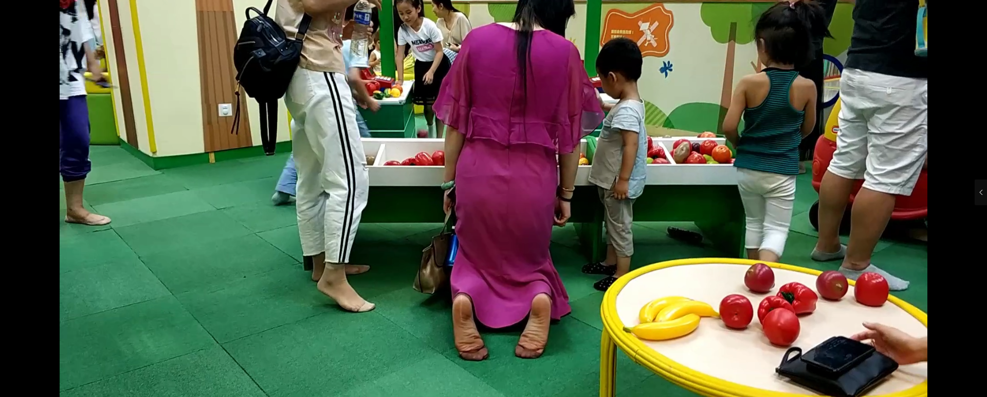 Lots of mother&#039;s black nylon feet from kids activity centre 3