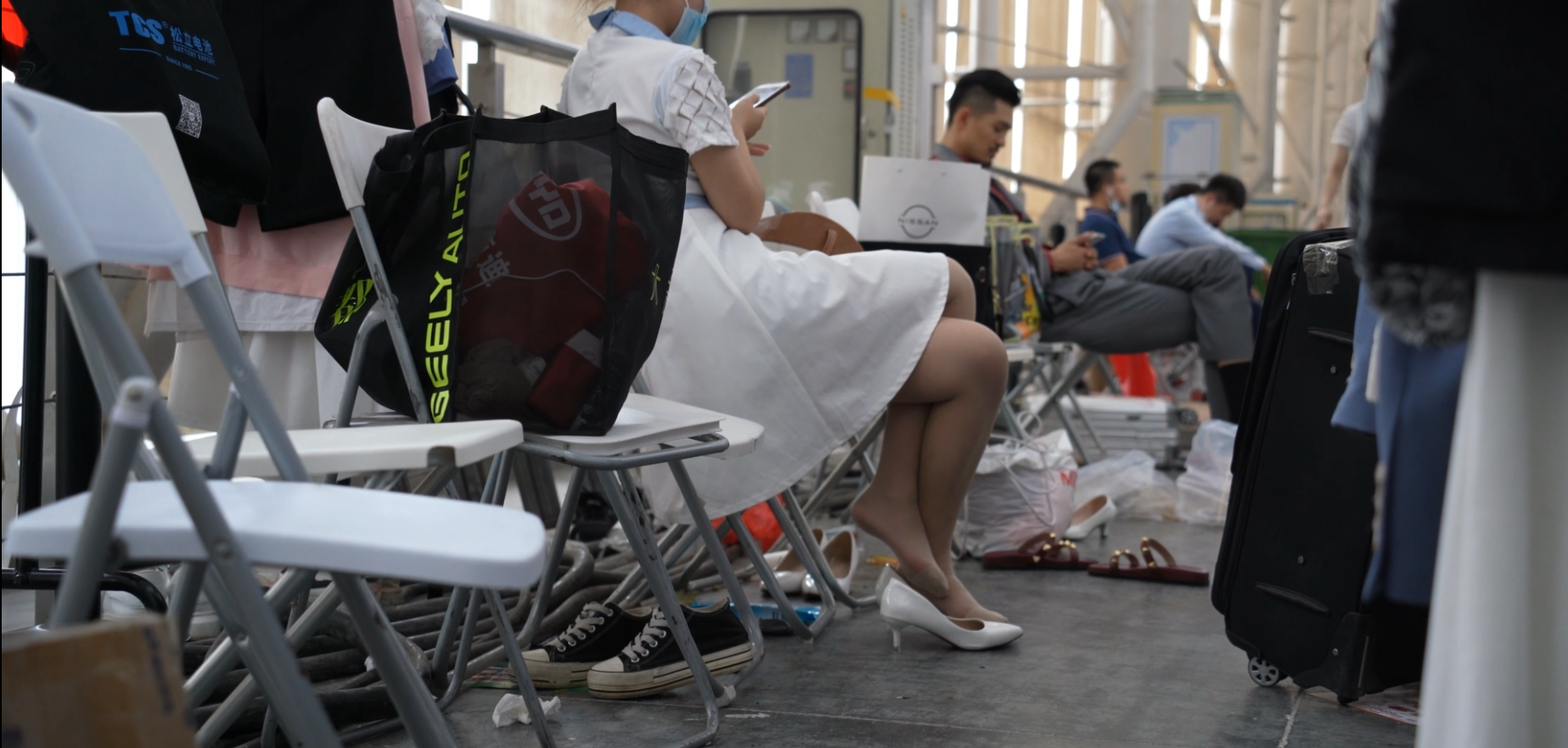 Group of hostess sit down relax their tired nylon feet 4
