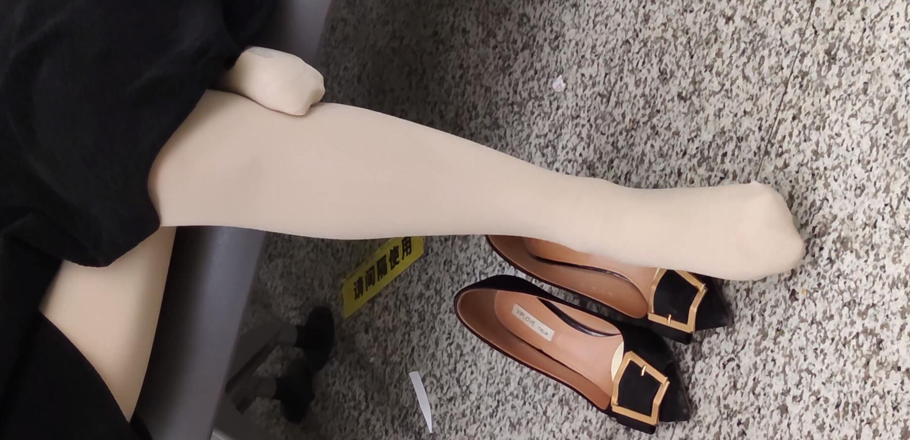 The hot girl remove heels relax her feet when waiting for a train