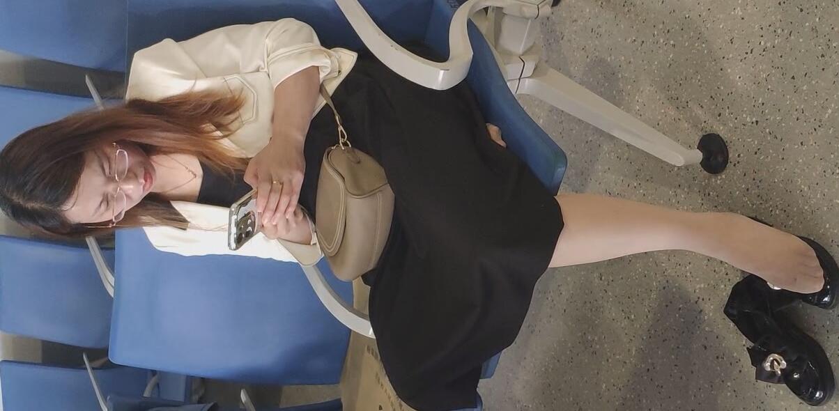 The beauty is looking at her phone carefully