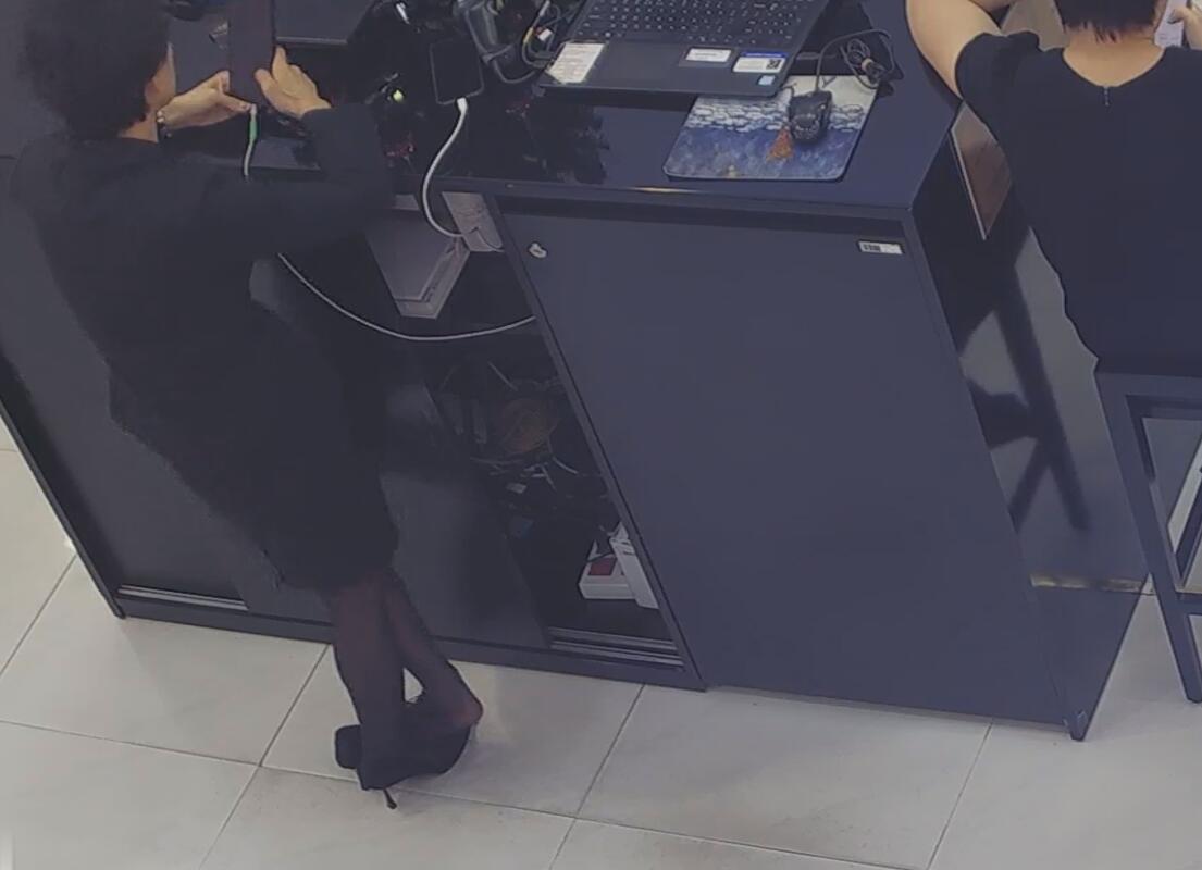 The jewelry store hostess in black nylon show us her cute feet! 105