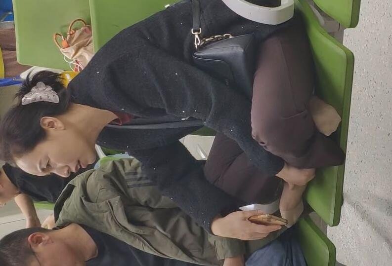 The lady remove heels relax her sexy nylon feet waiting for a call at the hospital 7