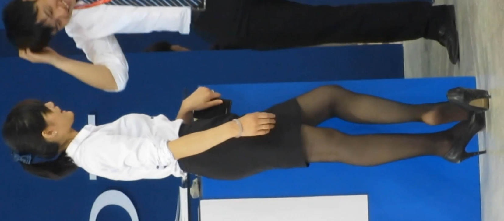 Girl in black nylon heels shoeplay for her co-worker 