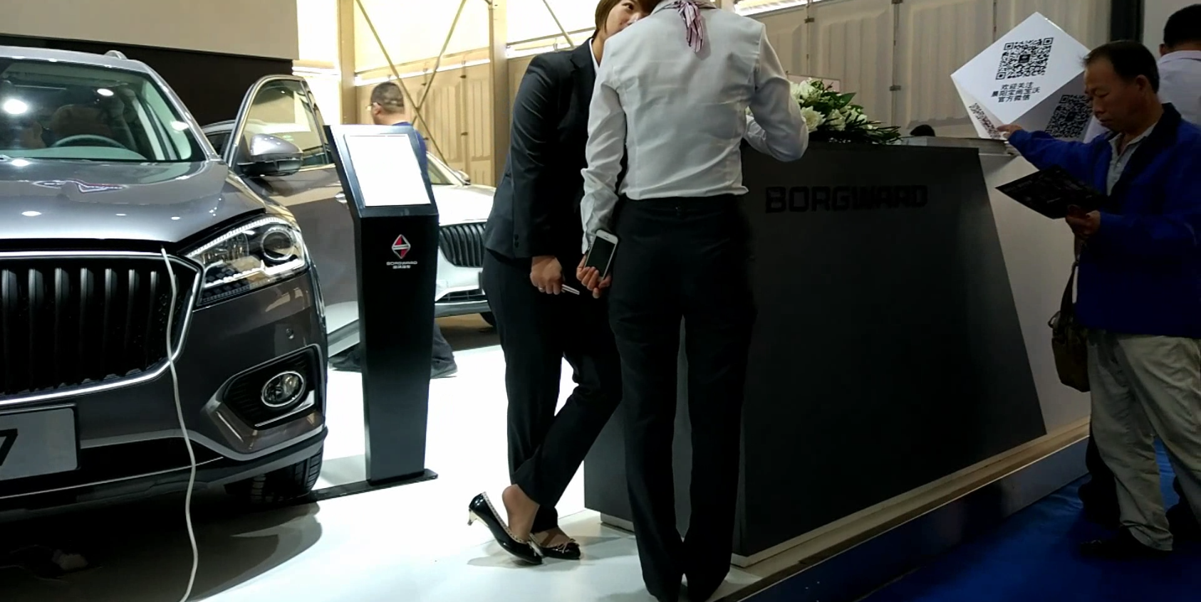 Car salesgirl stand up dipping shoeplay