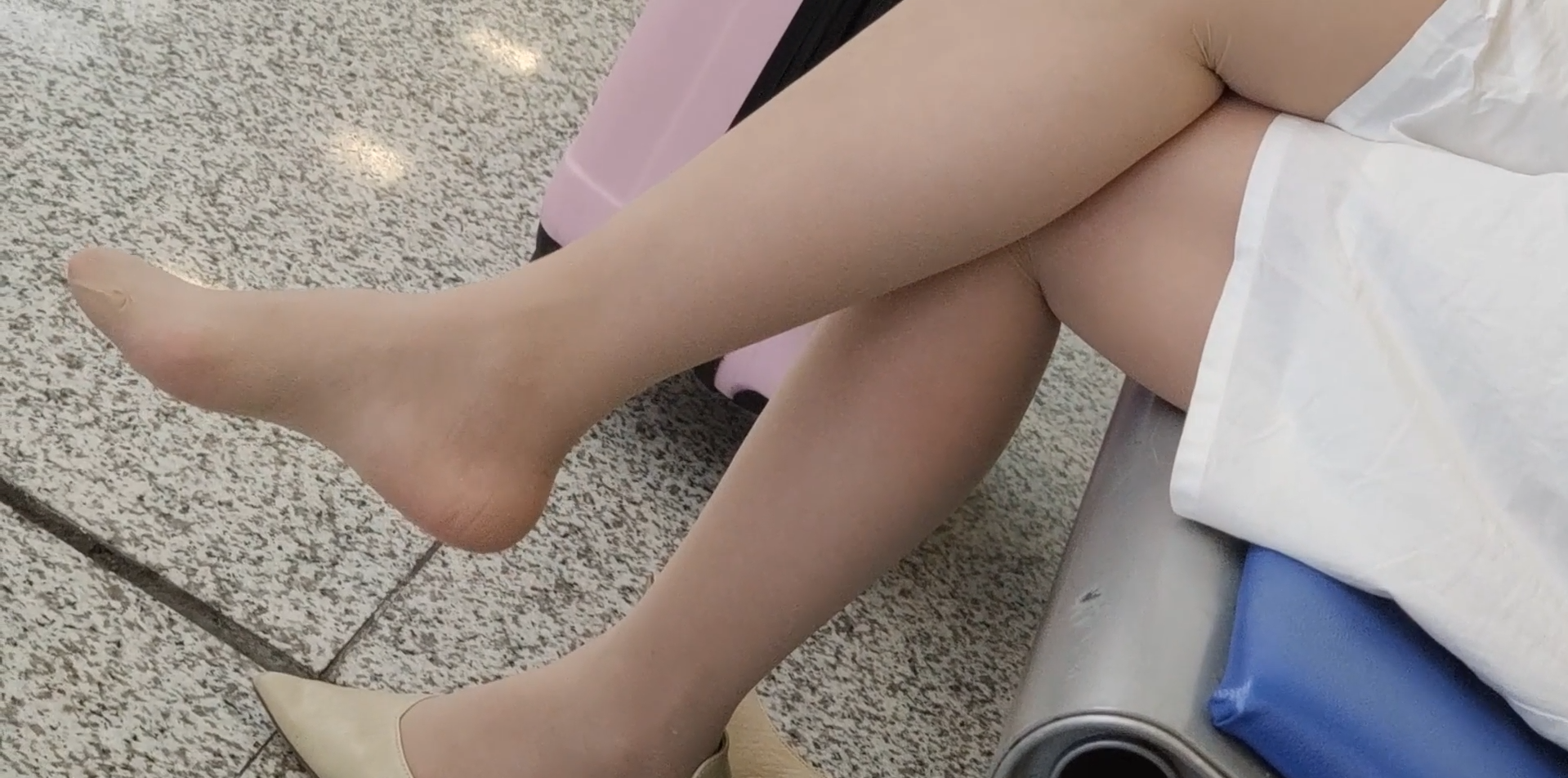 Girl dangling shoeplay when waiting for a train 16