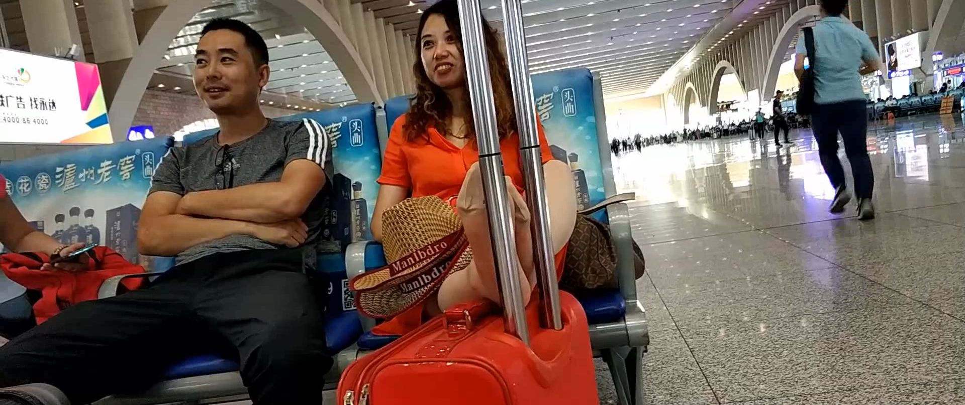Lady great dangling shoeplay when waiting for the train in railway station lounge 25