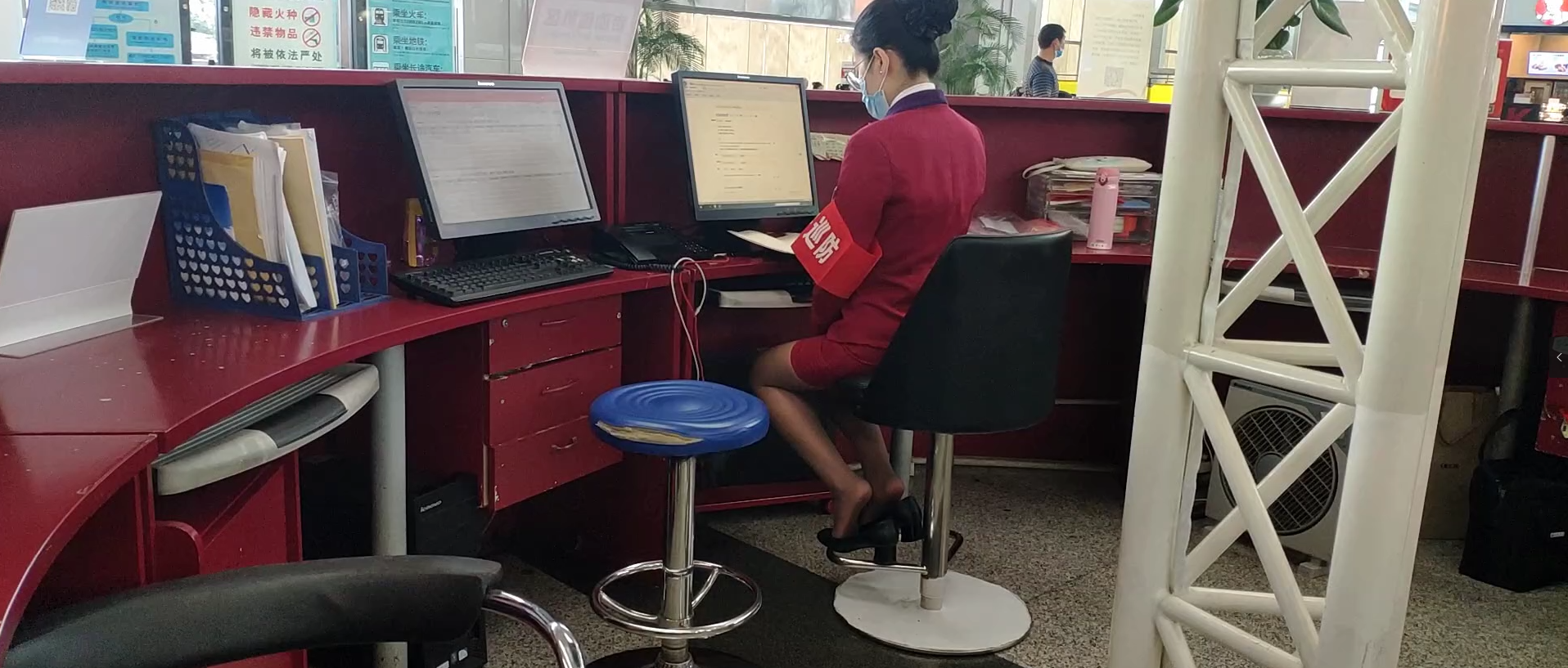 Airport receptionist sit down dipping shoeplay