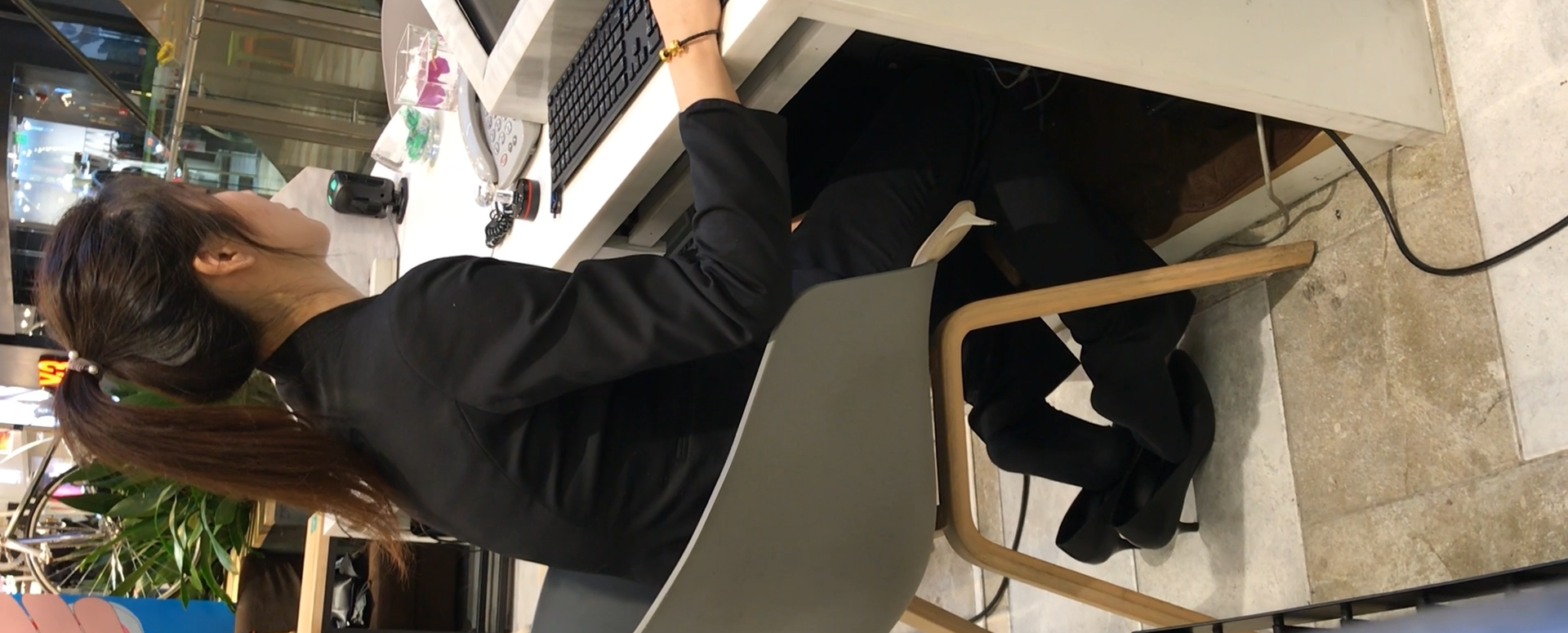 House sales lady dipping shoeplay under the table 2