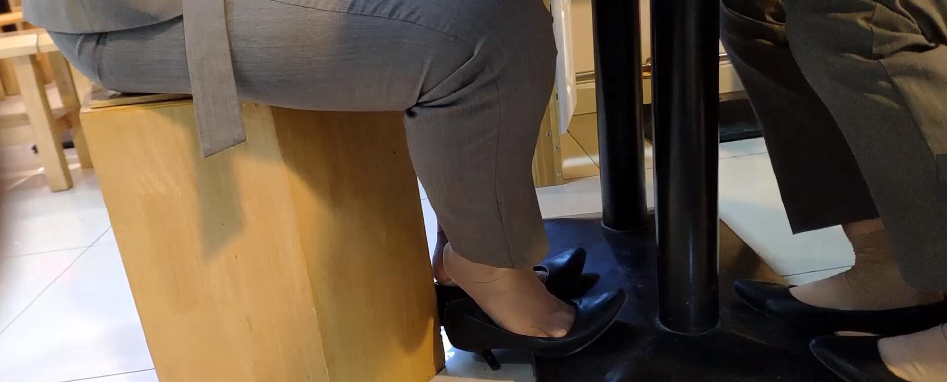 The girl dangling shoeplay under the table when having lunch 11