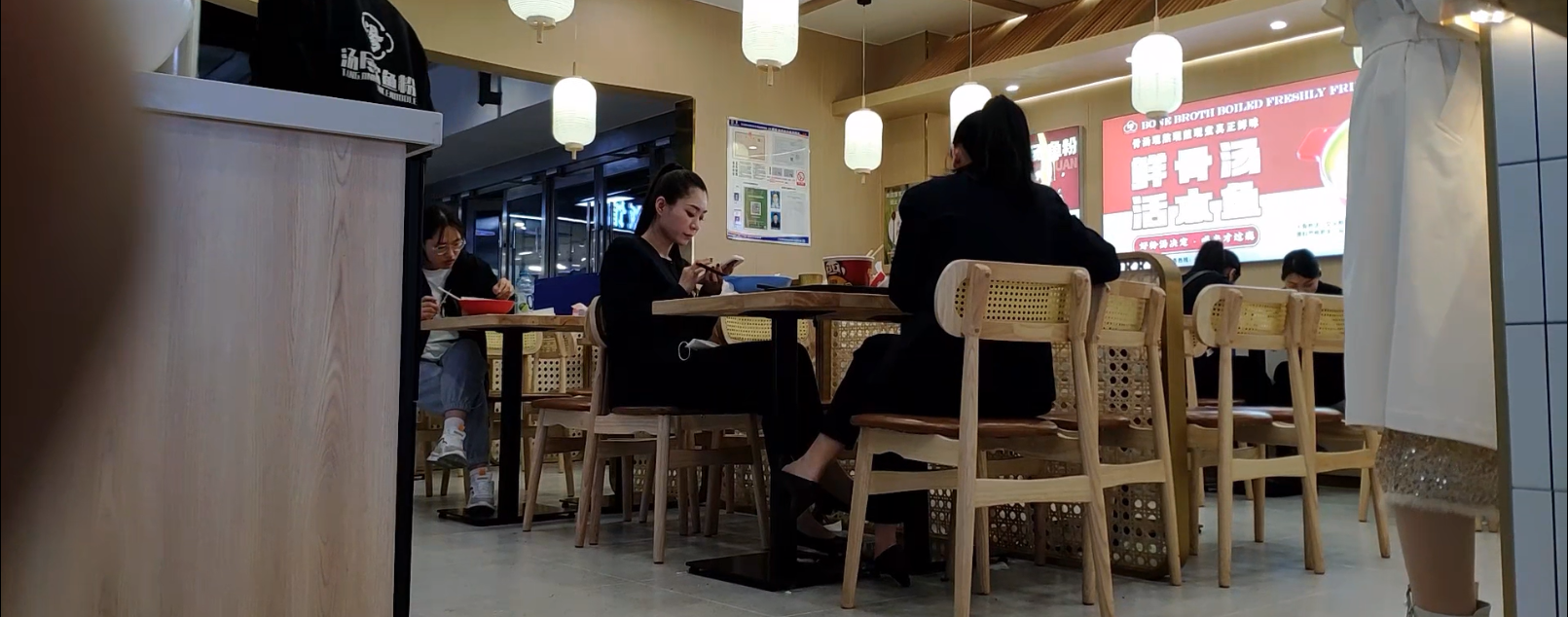 The girl dangling shoeplay when having lunch