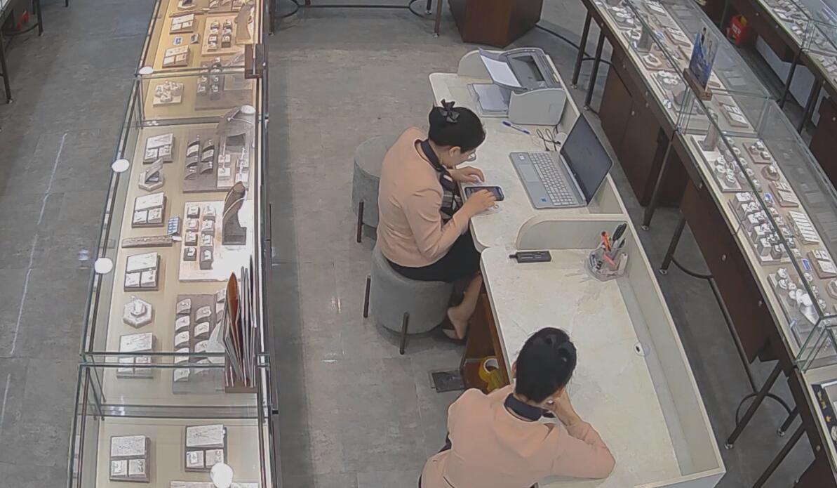 The jewelry store hostess looks like packing something