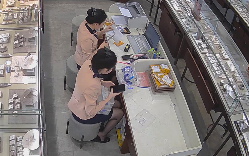 The jewelry store hostess in black nylon dipping shoeplay under the table 5
