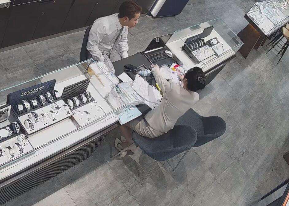 The jewelry store hostess in white dress and white heels sit down shoeplay 4