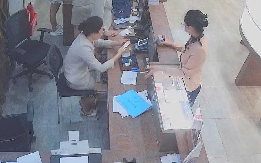 The jewelry store hostess in white dress and white heels sit down shoeplay 6