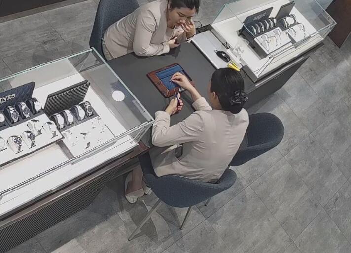 The jewelry store hostess in white dress and white heels sit down shoeplay 10