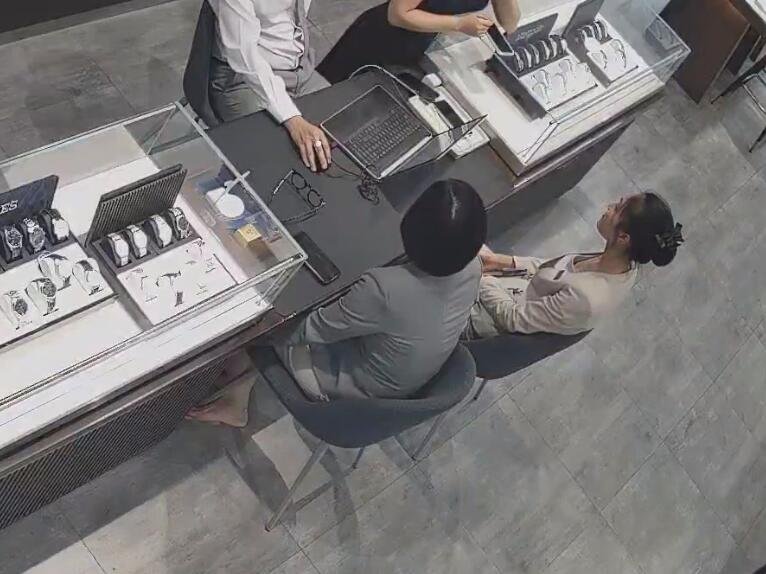 The jewelry store hostess in white dress and white heels sit down shoeplay 18