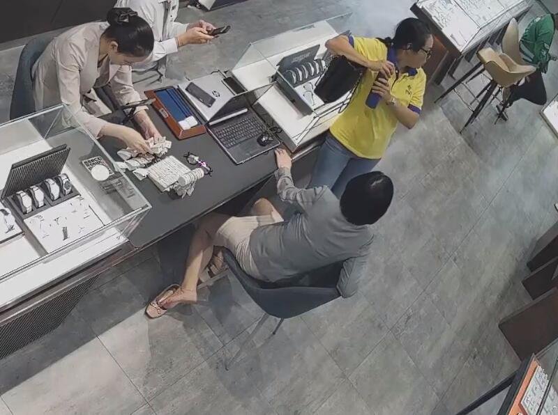 The jewelry store hostess in white dress and white heels sit down shoeplay 19